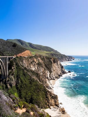 Pacific Coast Highway RV itinerary shown through an image of the bridge in Big Sur, Ca